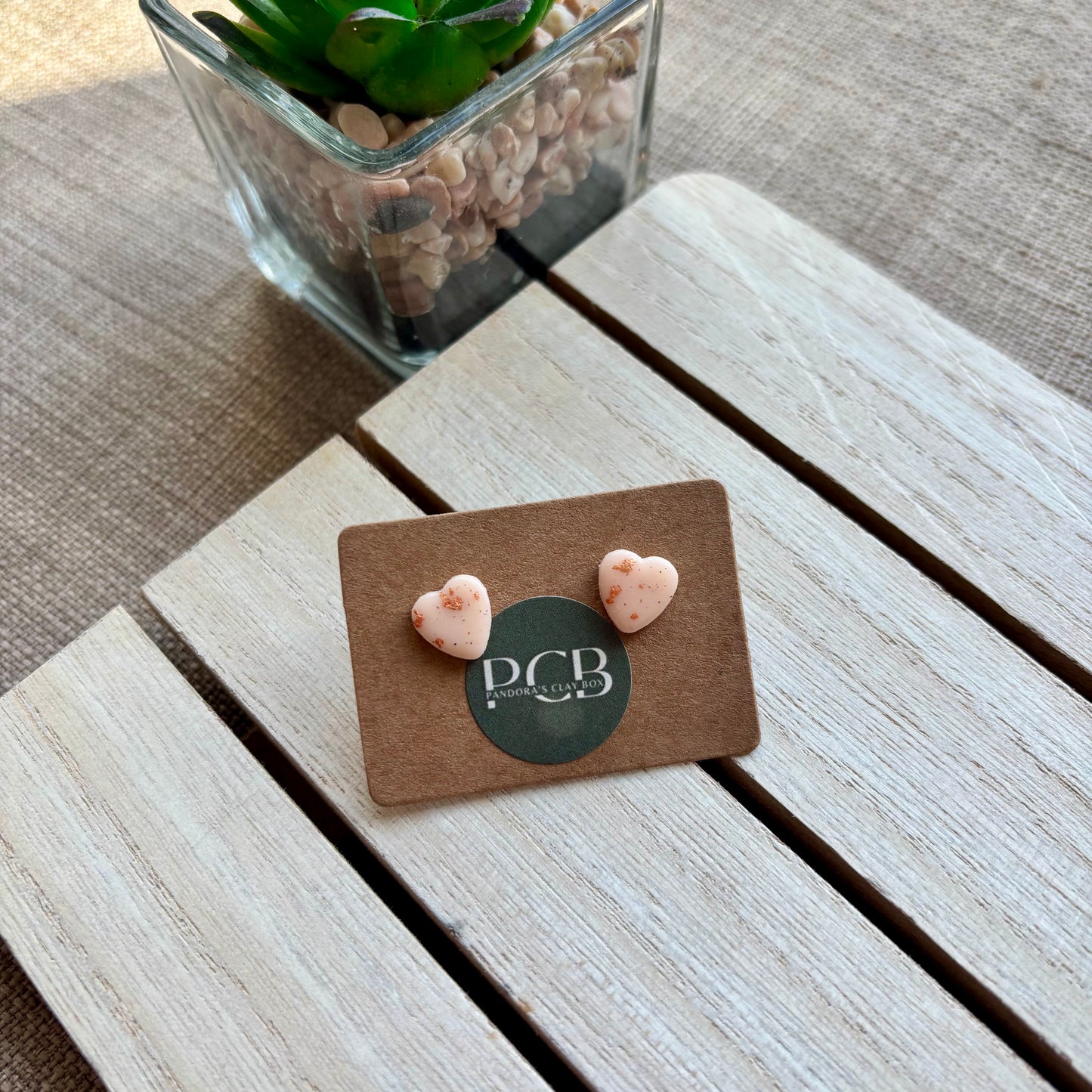 Nude/rose gold heart studs