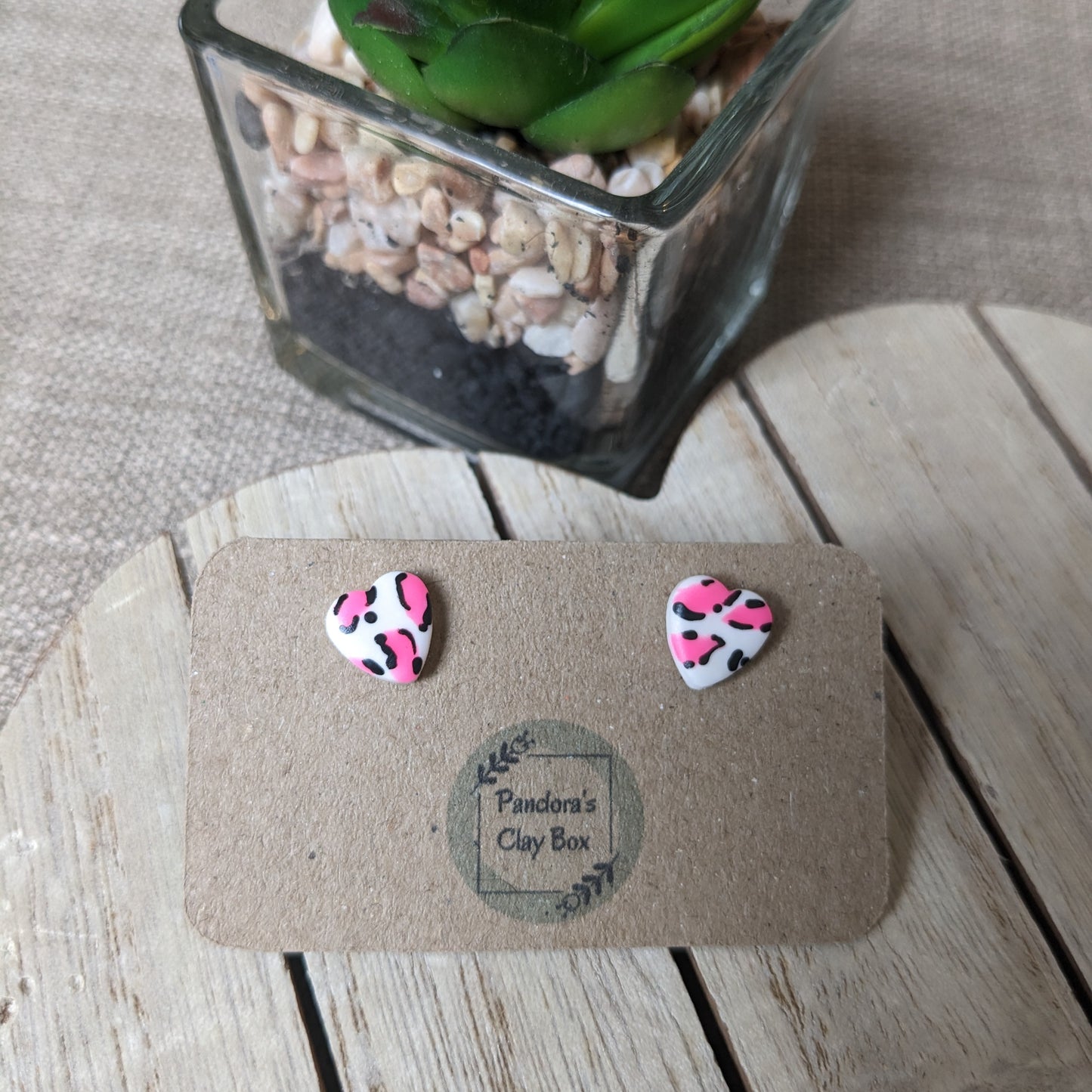 White/neon leopard heart studs