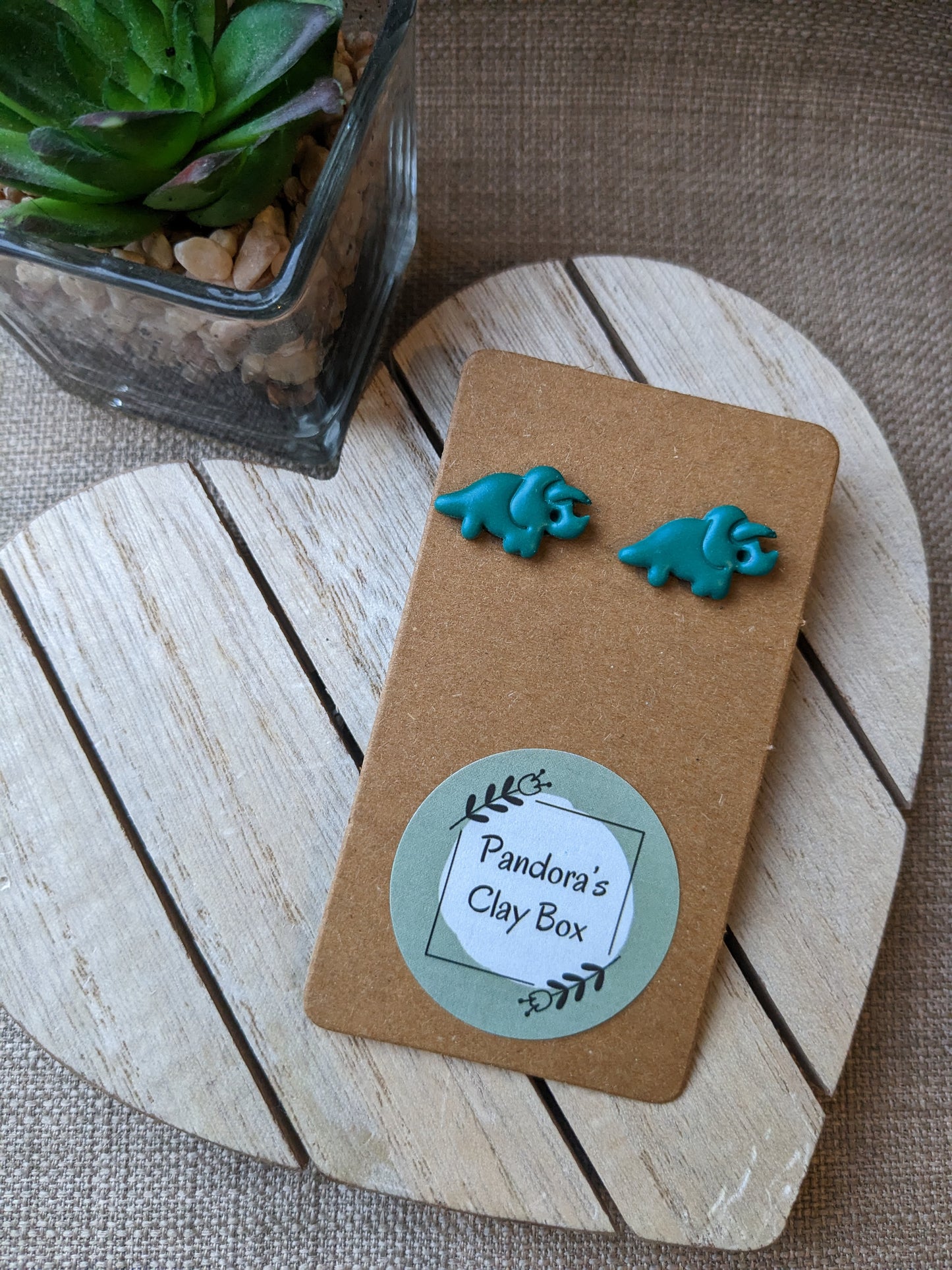 Green dino studs