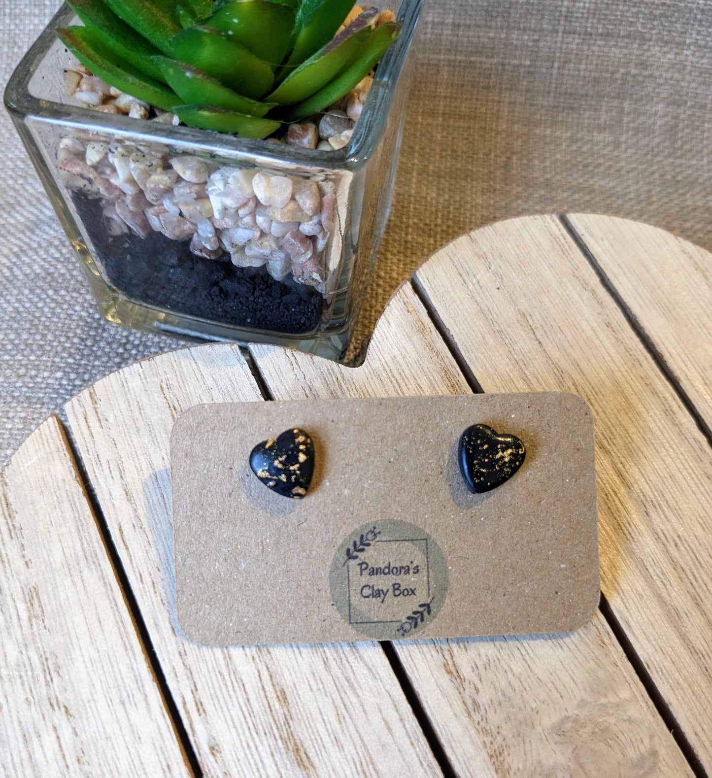 black/gold heart studs
